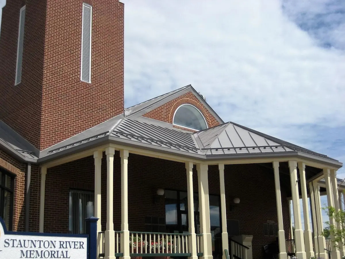 Skilled roofing craftsmen working on a residential roof in Smalltown